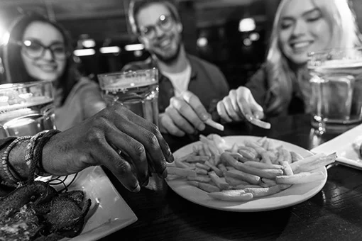 Group eating and drinking at Chicago Street Pub, Grill & Banquets in De Pere WI